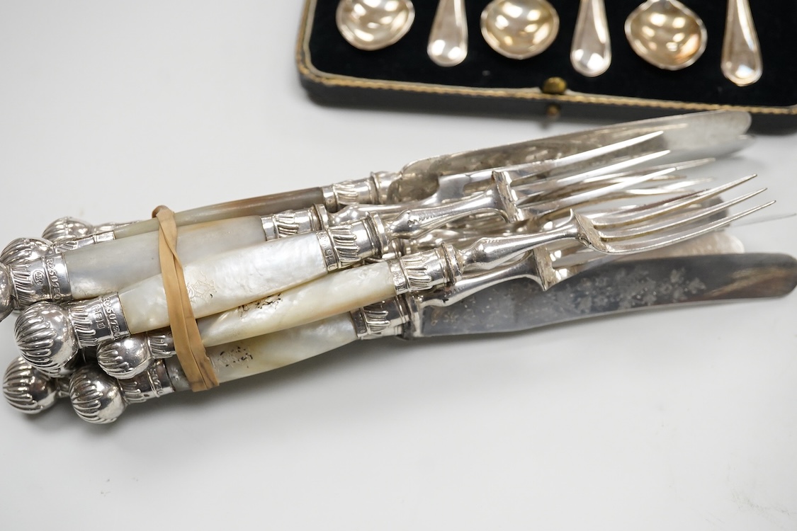 A cased Edwardian silver christening pair by Goldsmiths and Silversmiths Co Ltd, London, 1905, two cased sets of six silver teaspoons, one with a pair of sugar tongs, one other cased silver christening pair, a cased set